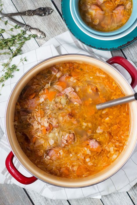 Try this hearty, warming and energizing Polish Sauerkraut Soup with sausage and bacon! | cookingtheglobe.com Polish Sauerkraut, Polish Soup, Sausage And Bacon, Soup With Sausage, Sauerkraut Soup, Eastern European Recipes, Polish Sausage, Sauerkraut Recipes, Ukrainian Recipes