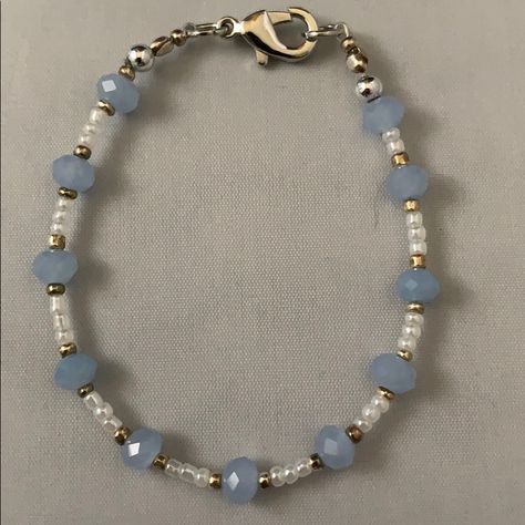 Handmade By Me, A Blue, White And Gold Small Bead Bracelet Accented In Silver. Bracelet Is 6 3/4” Long.