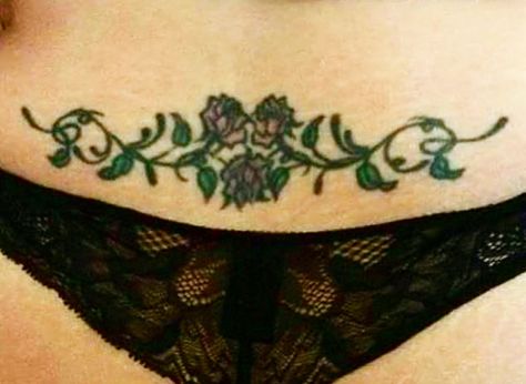 Rose vine low back tattoo Rose Lower Back Tattoo, Traditional Lower Back Tattoo, Vine Tramp Stamp, Rose Tramp Stamp, Low Belly Tattoo, Thigh Rose Tattoo, Low Stomach Tattoo, Low Back Tattoo, Rose Vine Tattoos