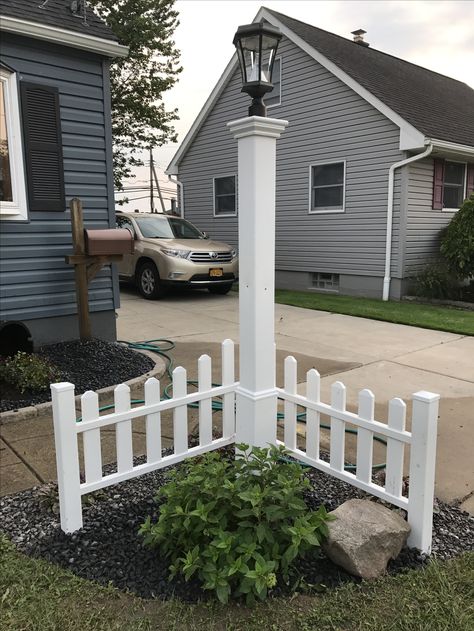 Corner Fence with solar lamppost Front Yard Corner Ideas, Front Yard Stone Wall Landscaping, Solar Light Post Front Yard, Solar Lamp Posts Front Yard, Corner Fence Ideas, Corner Fence Landscaping, Lamppost Landscaping, Front Yard Corner Landscaping, Lamp Posts Front Yard