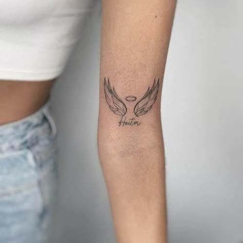 Angel Wings And Roman Numeral Tattoo, Youll Be In My Heart Always Tattoo, 222 With Angel Wings Tattoo, Memorial Angel Tattoo, Angle Wings Tattoo For Women, Letter With Angel Wings Tattoo, Cross And Angel Wings Tattoo, Feminine Angel Wings Tattoo, Detailed Angel Wings Tattoo