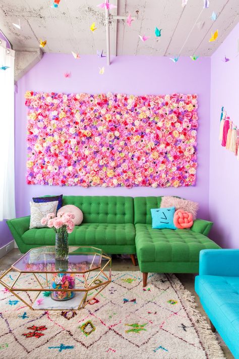 The incredible flower wall is another DIY by the couple and is made up of over 1200 silk flowers from Afloral...and LOTS of glue.  Feeling envious of Amina and Salvatore's gorgeous flower wall? Lucky for all of us they've started selling it in their online shop, Tassel Fairy. Colorful Apartment Decor, Purple Living Room, Colorful Apartment, Salon Suites, Living Room Photos, Deco Originale, Colorful Furniture, My New Room, Apartment Therapy