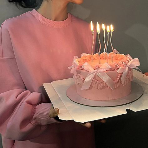 A girl in a pink hoodie holding her birthday pink cake with ribbons and silver candles :) Aesthetic Small Cake, Pastel Pink Cake Aesthetic, Ribbon Birthday Cake, Small Pink Cake, Pink Birthday Cake Aesthetic, Pink Bento Cake, Pink Mini Cake, Elegant Pink Cake, Pink Cake Aesthetic