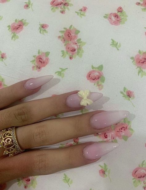 girly gradient pink nails with a cute and simple white bow Pink To White Gradient Nails, Natural Pink And White Nails, Pink Almond Nails With Bow, Pink And White Gradient Nails, Girly Acrylic Nails Almond, Pink Nails With Bow Charm, Pink And White Nails Almond, Coquette Acrylic Nails, Gradient Pink Nails