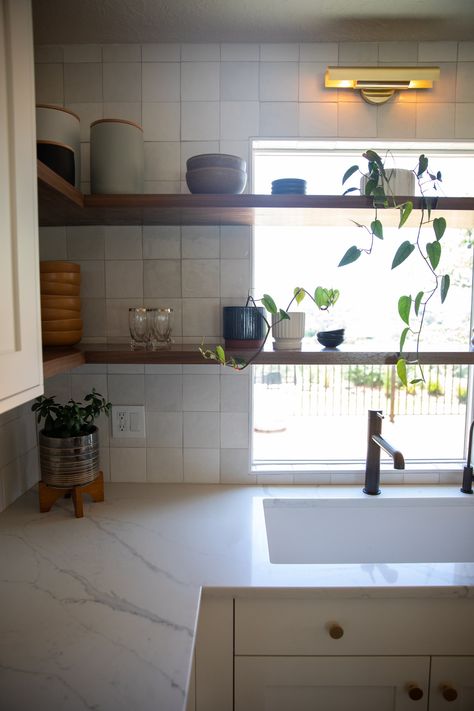 Chloe tile by Bedrosians. Walnut stained floating shelves. Quartz counter tops. This kitchen remodel is sitting pretty. Window Floating Shelves, Chloe Tile, Stained Floating Shelves, Walnut Floating Shelves, Quartz Counter, Sitting Pretty, Kitchen Tile, Parade Of Homes, Kitchen Window