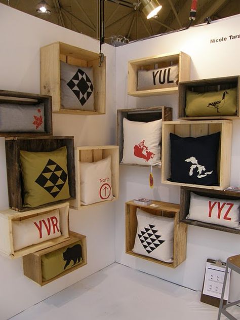 Attach old crates to the wall to use to display them. This would work for any item that fit in the boxes. If needed, attach a bit of wire mesh (chicken wire?) across the bottom of the crate opening to keep the items from falling out. Purse Display, Old Crates, Shop Displays, Jewellery Showroom, Craft Display, Shop Fittings, Craft Show Displays, Shop Decor, Merchandising Displays