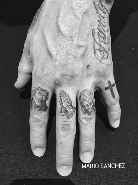 Christian Knuckle Tattoos, Bible Finger Tattoos, God Finger Tattoo, Aztec Finger Tattoo, Jesus Finger Tattoo, Compass Tattoo Finger, Small Praying Hands Tattoo, Christian Finger Tattoos, Men’s Finger Tattoos