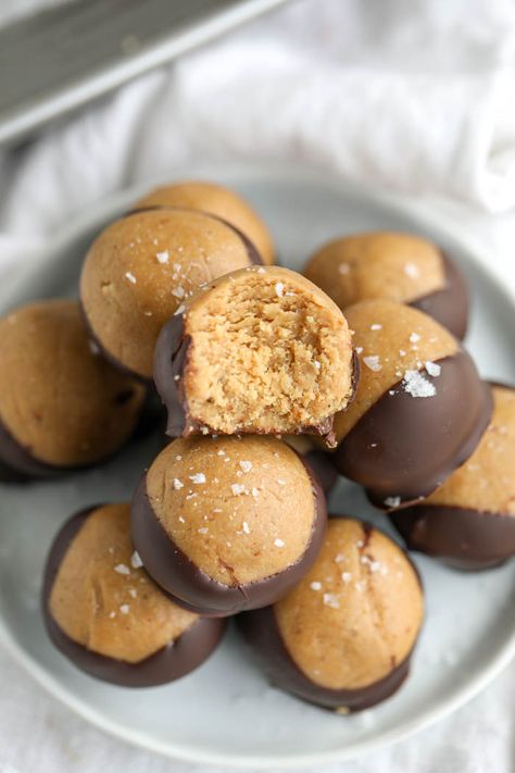 This Healthy Buckeyes Recipe is a dream come true. Made with chocolate, peanut butter, maple syrup, and other mouth watering ingredients, these vegan buckeyes are just too good. You can't eat just one! #healthysnacks #glutenfree #dairyfreesnacks #peanutbutter Guiltless Desserts, Peanut Butter Maple Syrup, Ella Vegan, Erin Lives Whole, Buckeyes Recipe, Peanut Butter Balls Recipe, Dairy Free Snacks, Butter Balls, Healthy Peanut Butter