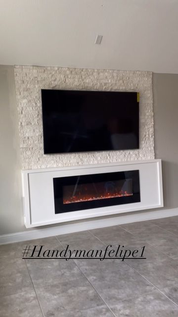 Handymanfelipe LLC on Instagram: "Floating Fireplace 🔥with Stone wall #livingroomdecor #livinroom #livingroomideas #livingroomdesign #livingroominspo #master #masterbedroom #madterbedroomdecor #floatingfireplace #accentwall #accentwalls #accentwallideas" Wall Mount Tv And Fireplace Ideas, Floating Fireplace Ideas With Tv, Wall Mounted Electric Fireplace Under Tv, Floating Fireplace Wall, Accent Wall With Fireplace And Tv, Fireplace With Stone Wall, Wall Mount Fireplace Ideas, Fireplace On Wall, Floating Fireplace Ideas