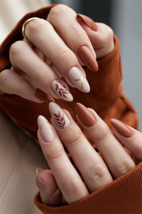 Embrace the essence of the season with these elegant autumn simple fall nail ideas that are effortlessly chic. Featuring muted tones of burnt orange and deep burgundy, this nail style encapsulates the warmth and beauty of autumn leaves. The addition of subtle gold accents brings just the right touch of glamour, making your nails the perfect accessory for any fall outfit. Dive into this seasonal delight and elevate your manicure game! Fall Drip Nails, Manicure Fall Nails, Simple Nail Ideas For Fall, Negative Space Nails Fall, Fall Nails Modern, Wedding Nails Alternative, Simple Fall Nail Designs Leaves, Fall Themed French Tip Nails, Maternity Picture Nail Ideas