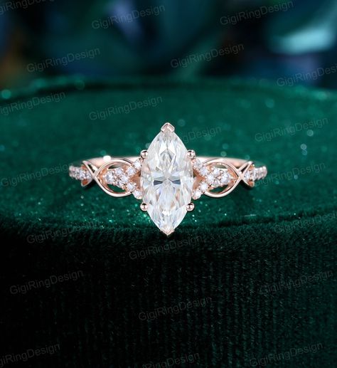 Description: - vintage engagement ring - comfortable band Shown: Solid 14K Rose Gold Main stone: 5*10mm Marquise cut 1.0ct Moissanite Side stone: 0.09ct diamond or moissanite Total weight:2.4g Shank width:1.5mm Shank thickness:1.2mm Metal: 18k or 14k solid gold Available in yellow, white or rose solid 14 or 18k gold. ADDITIONAL SERVICE: 1.Rush Order 2.Engraving Service 3.Payment Plan 4.One-year Free Warranty Senior Ring, Unique Vintage Engagement Ring, Twist Wedding Ring, Marquise Moissanite Engagement Ring, Marquise Wedding Ring, Pretty Engagement Rings, Dream Wedding Ring, Angel Energy, Rose Gold Engagement Ring Vintage