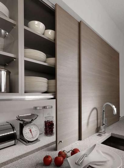 Hidden Kitchen Sliding Doors, Kitchen Cabinet Lift Up Door, Hidden Kitchen Storage Sliding Doors, Kitchen Hidden Storage, Pocket Door Slide Cabinet, Kitchen Cabinets Sliding Doors, Fitted Kitchen, High End Kitchens, Kitchen Fittings