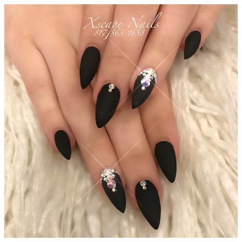 Wedding Black Nails For Bride, Matte Black Nails With Jewels, Matte Black Nails With Gems, Black Wedding Nails Almond, Black Jewel Nails Rhinestones, Black Matte Nails With Rhinestones, Black Nail Designs With Jewels, Black Nail Design With Rhinestones, Matte Black Oval Nails