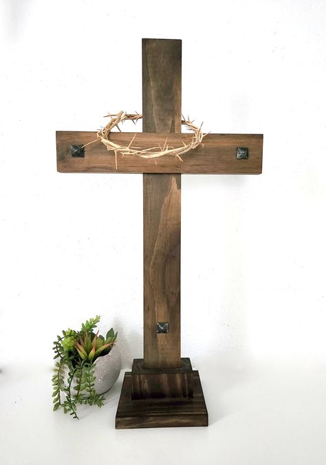 Cross is a symbol of Christianity that provides an infinite source of protection, blessing, hope and strength to all people, and is a beautiful way to represent the faith. BEST GIFT IDEA:  Wood creates a very natural atmosphere, bringing spiritual warmth and blessing to your home. This Cross on the base is made from select, lightly distressed wood and accented with the three hand forged nails. Stunning centerpiece, and a true work of art! The big variety of stains and dimensions are available at the check out. EASY WALL APPLICATION: Cross comes with the predrilled keyhole and a screw. All you need is to find a place on the wall where you want to place the cross! SHIPPING: Cross will be shipped in 2 interlocking pieces. The assembly is very easy. Put two pieces together and connect them wit Outdoor Dining Table Diy, Large Wooden Cross, Wooden Crosses Diy, Crosses Diy, Home Chapel, Luther Rose, Iron Nails, Church Home, Space Beautiful