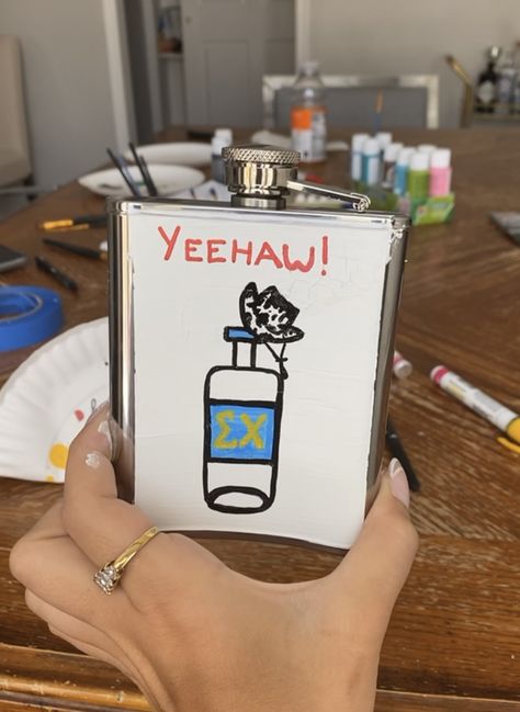 Yeehaw. Cowboy hat. Alcohol. Tito’s. Country flask. Cowboy flask. Fraternity formal. Sigma chi. Painted Flask Ideas, Fraternity Flask Painted, Painted Flask Fraternity, Frat Paddle Ideas, Decorated Flask, Flask Ideas Diy, Formal Flask, Flask Painting, Fraternity Flask