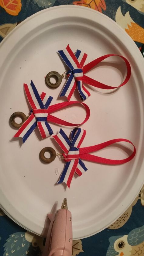 Ornaments made from flag grommets after a flag retirement ceremony. Flag Retirement Ceremony Scouts, Flag Retirement Ceremony, Ahg Our Flag Badge Explorer, Ahg Swaps, Military Retirement Party, Military Retirement Party Ideas, Military Retirement Parties, Cub Scout Crafts, Eagle Scout Ceremony