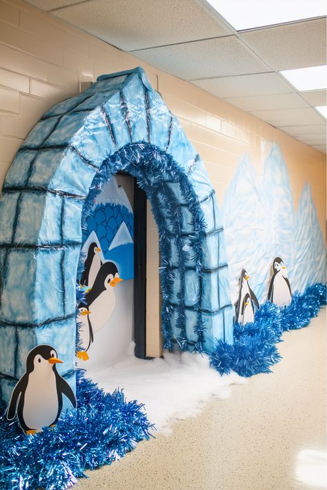 Why settle for basic when you can have penguins and an igloo? I love how this idea brings so much life and energy to a classroom door! A foam arch igloo wrapped in paper, blue tinsel, and waddling penguins make it so vibrant and fun. Go big with this playful Christmas classroom door decor idea—it’s totally worth the effort. Frozen Door Decorations Christmas, Winter Day Decoration In School, Snow Classroom Decorations, Diy Igloo Craft, Igloo Bulletin Board Ideas, Igloo Classroom Door, Winter Classroom Theme, Igloo Door Decorations For School, Winter Door Decorating Contest