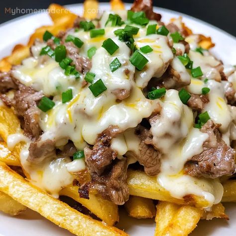 Philly Cheesesteak Fries are an indulgent snack made with crispy fries, tender shaved steak, and a deliciously creamy cheese sauce. A quick and flavorful dish perfect for sharing! Philly Cheesesteak Fries, Cheesesteak Fries, Melted Cheese Sauce, Shaved Steak, Farmhouse Recipes, Steak Chili, Creamy Cheese Sauce, Crispy Fries, Homemade Cheese Sauce