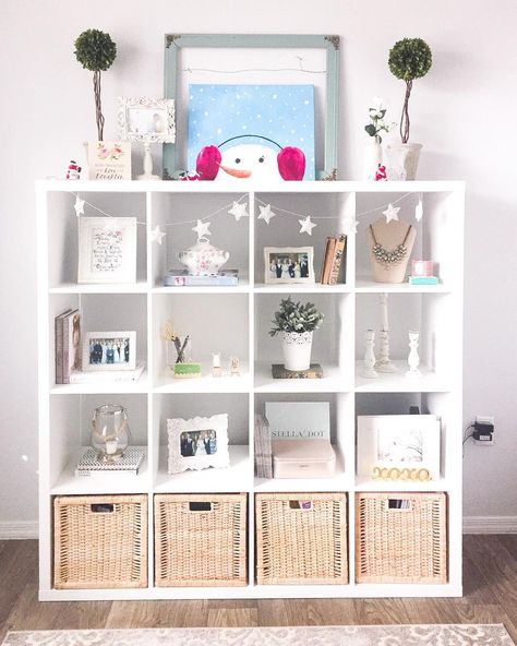 I've been looking for functional ways to decorate my feminine home office since I started working from home. I picked up the IKEA Kallax Shelf Unit to provide more decor storage and organization for files and paperwork. It's a great piece for those on a budget who are looking to add storage to a small space. I also love how easy it is to add festive holiday decor to my office during the Christmas season. Baby Zimmer Ikea, Ikea Kallax Bookshelf, Kallax Ideas, Ikea Kallax Shelf Unit, Feminine Home Office, Home Office Design On A Budget, Feminine Home, Ikea Kallax Shelf, Feminine Home Offices