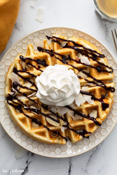 This easy homemade dessert waffles have a coconut flair and taken to a sweet level with coconut milk, sweet coconut flakes, almonds, chocolate sauce, and whipped cream! Sweet Waffle Recipe, Waffles And Ice Cream, Blueberry Oatmeal Pancakes, Almonds Chocolate, Easy Homemade Desserts, Challah French Toast, Dessert Waffles, French Toast Rolls, Coconut Dessert