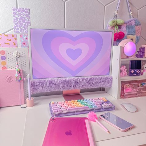 Happy Sunday! 💜 Links to items on my desk are linked in my bio 💜 • • • What’s on my desk? • • • Computer: Pink iMac @apple Wallpaper: @mollandslane Keyboard base: @kiiboom.official Keycaps: @keygeak_official Phone: Purple iPhone 11 @apple Tablet: Pink iPad 10th generation @apple “Amongus” light: @divoom_global Purple Game Console: @litnxt_official Bag: @retromingle Purple Gummy Bear Candle: @mycozyolo • • • Tags • • • #pink •💜• #purple •💜• #desksetup •💜• #pinkdesksetup •💜• #purpl... Lilac Desk Aesthetic, Pink Keyboard Desk Setup, Pink Imac Desktop, Lavender Keyboard, Purple Imac, Imac Stand, Purple Desk, Purple Games, Bear Candle