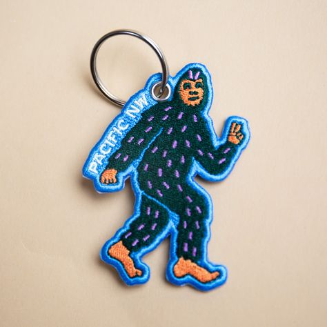 2.29" x 3.25" double-sided embroidered keychain with a key ring. Outdoorsy Boyfriend Gifts, Patch Keychain, Sewn Keychain, Embroidered Keychains, Cute Key Chains, Thesis Ideas, Voynich Manuscript, Bigfoot Sasquatch, Mens Hats