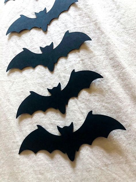 Halloween (or just October) is here! These Halloween Paper bats are the perfect spooky decoration to spruce up your place! They are made of 60lb sturdy cardstock and you are able to bend the wings to give some dimension when you hang them (creates a great shadow!)  I hung mine with just some craft tape but painter's tape works great too. You will receive them in a flat envelope with cardboard to make sure nothing gets bent in shipping. Set of 7 (5.00) You will receive: 5 Medium-Large bats ( appr Bat Cut Out, Paper Bats, Halloween Window Silhouettes, Bats For Kids, Crafts Aesthetic, Paper Bat, Bat Decorations, Paper Craft For Kids, Halloween Window