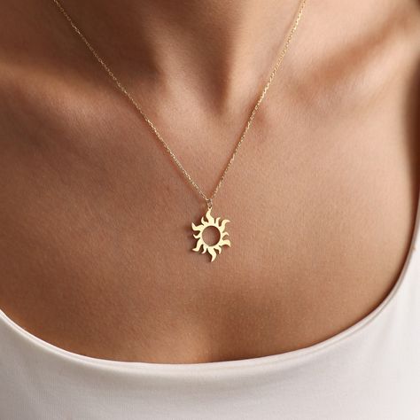 The Minimal Sun necklace stands out as a unique piece of handmade astrology and celestial symbolic jewelry. It is adorned with minimalistic design elements inspired by the sun. This elegant gold sun necklace will reflect your brightness on those wonderful days. MATERIAL 14kt Gold-Filled jewelry is crafted by bonding a plated layer of 14kt gold onto another metal. However, this layer is 1000 to 10,000 times thicker than gold plating. As a result, it creates a durable, long-lasting product that re Celestial Necklaces With Sun And Moon Design For Gift, Celestial Sun And Moon Design Necklace As Gift, Handmade Celestial Charm Necklaces As Gifts, Dainty Sun And Moon Charm Necklaces As A Gift, Dainty Sun And Moon Design Charm Necklace As Gift, Dainty Sun And Moon Charm Necklace For Gift, Dainty Sun And Moon Charm Necklace Gift, Handmade Celestial Jewelry For Everyday, Handmade Celestial Everyday Jewelry