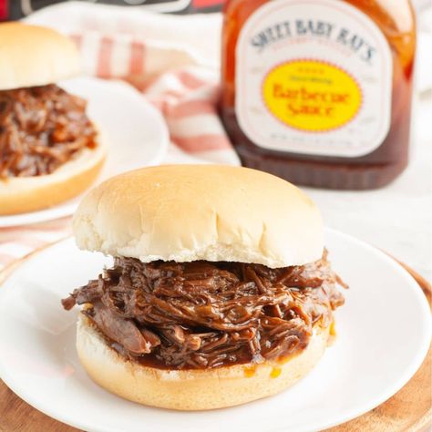 BBQ beef sandwich on a plate with a bottle of BBQ sauce. Slow Cooker Bbq Beef, Bbq Beef Sandwiches, Crock Pot Food, Bbq Sandwich, Slow Cooker Ribs, Slow Cooker Meatballs, Slow Cooker Bbq, Bbq Seasoning, Bbq Beef