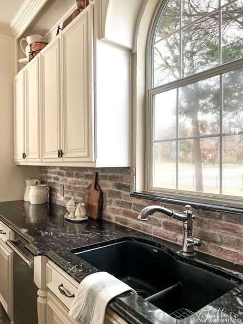 Brick Backsplash With Black Countertops, Black Brown Countertops Kitchen, Farmhouse Kitchen Brick Backsplash, White Cabinets Black Granite, Black Granite Countertops Kitchen, Modern French Country Kitchen, Kitchen Black Counter, Redo Kitchen, French Country Kitchen Cabinets