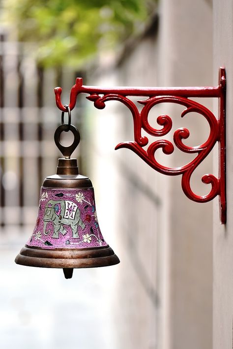 Vintage temple bell with elephant print hang on red metal wall bracket available on sale on indianshelf. Temple Door, Wood House Design, Antique Bell, Temple Bells, Temple Decor, Indian Doors, Big Rangoli Designs, Hanging Bell, Door Bell