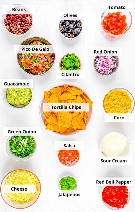 Loaded Veggie Nachos | The Picky Eater Nachos No Meat, Veggie Nachos, Traditional Refried Beans, Sour Cream Uses, Clean Eating Plans, Corn Tortilla Chips, Bean Tacos, No Meat, Cheese Stuffed Peppers