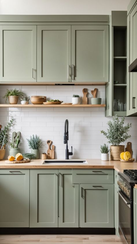 Sage green cabinets and oak wood countertop with a white subway tile backsplash. Click now to read my interior design blog. What do you guys think? #kitchendesign #kitchenrenovation #kitchenmakeover #kitchendesignideas #greenkitchen #kitchencountertop #kitchendecorideas Green Kitchen Color Scheme, Kitchen Cabinets Green, Modern Green Kitchen, Color Scheme Green, Kitchen Ideas Green, Green Kitchen Aesthetic, Green Kitchen Inspiration, Kitchen Color Scheme, Green Kitchen Ideas