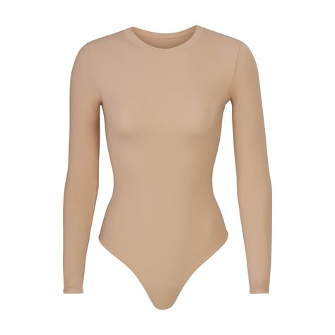 Our classic crew neck long sleeve bodysuit updated in lightweight, buttery soft fabric that hugs your curves. An essential styling piece to add to your rotation. Square Neck Bodysuit, Tank Bodysuit, Beauty Guru, Size 16 Dresses, Hug You, Body Suit, Long Sleeve Bodysuit, Soft Fabric, Comfort Fit