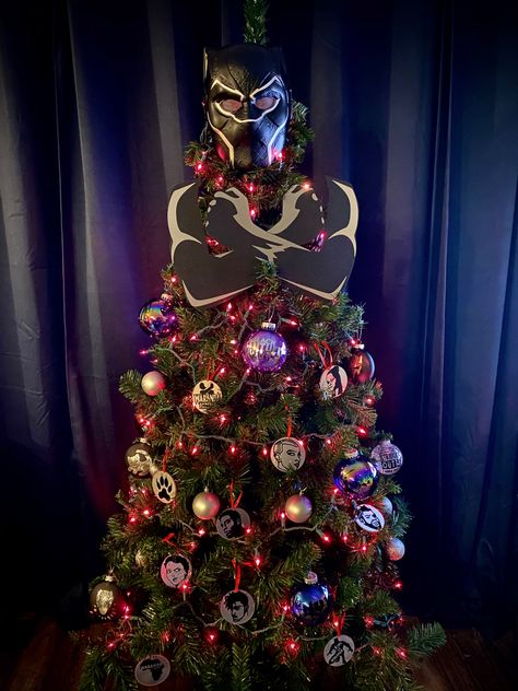 Paying tribute to my favorite Marvel movie, Black Panther. The ornaments were made on a Cricut Maker with self-adhesive vinyl. Black Panther Christmas Tree Ideas, Marvel Xmas Tree, Black Panther Christmas Tree, Black Panther Tree, Avengers Tree Christmas, Black Panther Christmas, Marvel Ornaments Diy Christmas Trees, Christmas Tree Creative, Star Wars Chritmas Tree