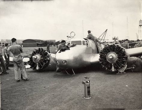 Amelia Earhart's heavily damaged Lockheed Electra 10E Special, NR16020, after a ground loop on takeoff at Luke Field, Hawaii, 20 March 1937. The damaged propellers and engine cowlings have already been removed. The fuselage fuel tanks are being emptied. (Purdue University Libraries, Archives and Special Collections) Amelia Earhart Plane, Lockheed Electra, Pearl Harbor Hawaii, Aviation Accidents, Flying Vehicles, Air Craft, Amelia Earhart, Aircraft Photos, Wwii Aircraft