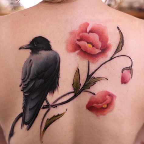 Raven tattoo with poppy flowers #raven #crow #flowers #watercolor #redflowers #poppies #raventattoo #feminine #back #backpiece #birdandflowers #bird #poppy Crow Cherry Blossom Tattoo, Flowers Tattoo Back, Raven Tattoo Feminine, Crow Tattoos, Crow Tattoo Design, Trash Polka Tattoo Designs, Flower Tattoo Back, Poppies Tattoo, Crow Tattoo