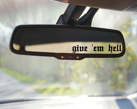 Show your bold personality with the Give Em Hell Car Mirror Decal! Attach this decal to your car mirror to make a statement and turn heads. Its vibrant colors will add a bit of flair to your vehicle and make you stand out in any crowd. Let your true colors shine with this unique accessory! **Please measure your area to make sure this fits your space**All decal pictures are for DISPLAY PURPOSES ONLY. They are not scaled to size. Sizes provided are in the drop-down box with the available sizes for White Jeep Decor, Decals For Cars Women, Grunge Car Accessories, Goth Car Decals, Spooky Car Decals, Rear View Mirror Decals, Rearview Mirror Decal, Spooky Car Decor, Emo Car Decor