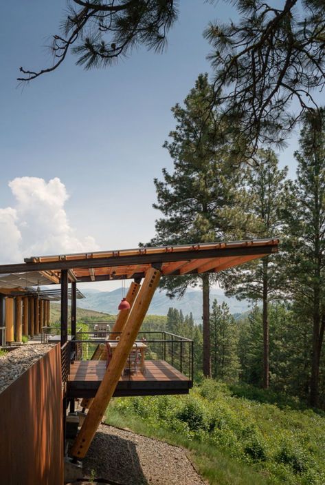 This eco-friendly cabin designed by Prentiss Balance Wickline Architects is nestled in the mountains in Winthrop, Washington State. Green Cabin, Hillside House, Prefab Cabins, Modern Mountain Home, Residential Architect, Light Pole, Modern Mountain, Mountain Homes, Cabin Design