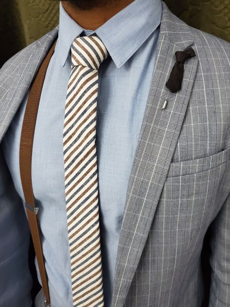 A true gent dappers up to attend a wedding. show off your style in our striped blue stone oxford tie and pair it with some brown suspenders. The brown tie lapel pin ties the look together. blue shirt, grey checkered suit. Suits With Suspenders Mens, Mens Suit And Tie, Fashionable Workwear, Suit With Suspenders, Summer Tailoring, Mens Shirt And Tie, Men's Suspenders, Tall Men Fashion, Shirt And Tie Combinations