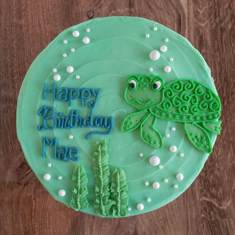 This gluten-free birthday cake is decorated with a sweet little sea turtle swimming around in an ocean of edible pearl bubbles. Turtle Decorated Cake, Salmon Birthday Cake, Two Year Old Turtle Birthday, Turtle Themed Cake, Sea Turtle Cake Ideas, Sea Turtle Themed Birthday Party, Turtle Cake Design, Turtle Cake Ideas, Sea Turtle Birthday Cake