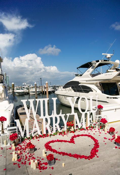 This Will You Marry Me setup is the best proposal idea if you want to pop the question at marina or near the yacht! Rose petals, candles and a big sign make the strong statement! #yachtproposal #proposalideas #willyoumarryme Yacht Proposal Ideas, Miami Proposal Ideas, Boat Proposal Decoration, Proposal Set Up Ideas Beach, Will You Marry Me Ideas, Will You Marry Me, Proposal Setups, Will You Marry Me Beach, Beach Marry Me Proposal