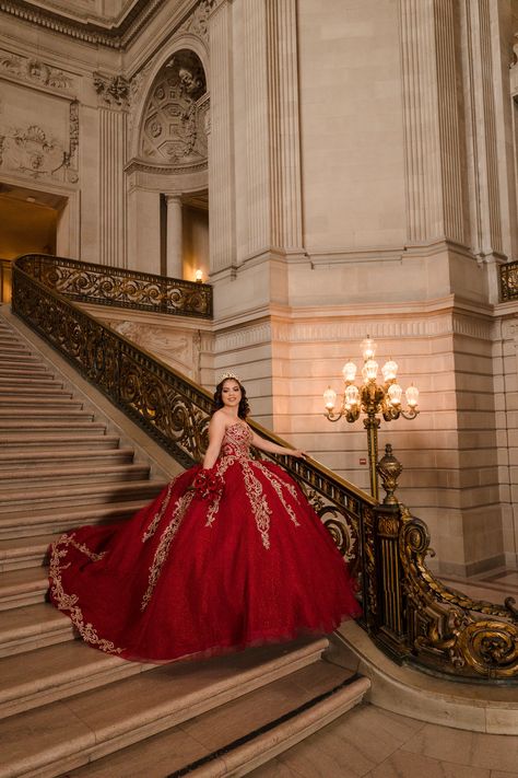 Beautiful Quinceanera by the staircase in stunning red dress for San Francisco City Hall pre-event session captured by wedding and portrait photographer based in Sacramento CA Red Quince Photoshoot Ideas, Quince Pictures Ideas, Pre Debut Shoot Ideas, Quincenera Dresses Red, 15 Photoshoot Ideas, Quince Poses Photo Shoots, Quince Poses, Quince Picture Ideas, Quince Photos