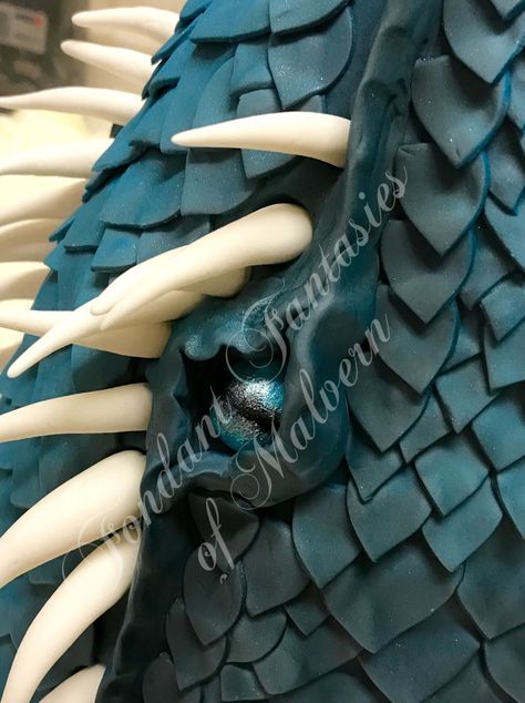 Blue tonal dragon scale cake  The eye of a dragon in cake  Visit the link below Dragon Scale Cake, Fondant Dragon, Cake Dragon, Dragon Birthday Cakes, Dragon Cakes, Fashion Cake, Dragon Cake, Dragon Birthday, Dragon Scales