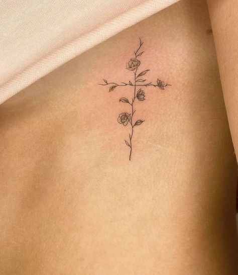 Simple Line Spine Tattoo, Collar Bone And Shoulder Tattoo, Cross Tattoo Placement For Women, Dainty Religious Tattoos, Flower Cross Tattoos For Women, Rib Cross Tattoos For Women, Elegant Cross Tattoo, Women’s Cross Tattoo, Cross On Ribs Tattoo