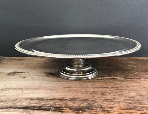 vintage cake stand silverplated pedestal cake stand silver dessert server cake shop display ornate round silver cake plate decorative stand by GlyndasVintageshop on Etsy Cake Shop Display, Plated Cake, Asian Wall Decor, Silver Cake Stand, Marble Candle Holder, Silver Cake, Decorative Stand, Vintage Cake Stands, Marble Candle