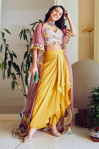 Buy Kresha Lulla Maroon Raw Silk Embellished Cape And Draped Skirt Set Online | Aza Fashions Haldi Dress, Haldi Outfits, Haldi Outfit, Trendy Outfits Indian, Indo Western Dress, Pink Lehenga, Indian Dresses Traditional, Draped Skirt, Designer Dresses Casual