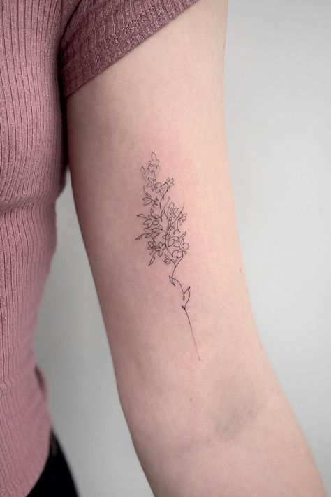 Beautiful Lilac Tattoos: Ideas, Designs, and Meanings Lilac Minimalist Tattoo, Small Lilac Tattoo Simple, White Lilac Tattoo, Lilocks Flower Tattoo, Lilac Bouquet Tattoo, Simple Lilac Tattoo Black And White, Simple Lilac Tattoo, Lilac Tattoo Black And White, Lilac Flower Tattoo