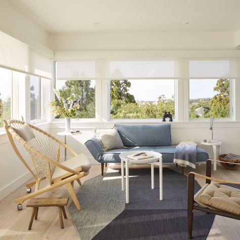 At one end of the living room, a drop-down sofa from the Danish Design Store converts into a single bed for extra guests. Small Coastal House, White Beach Cottage, Renovated Cottage, Eclectic Spaces, Corner Windows, Shiplap Paneling, Coastal Interior Design, Cape Cod Cottage, Coastal Interior