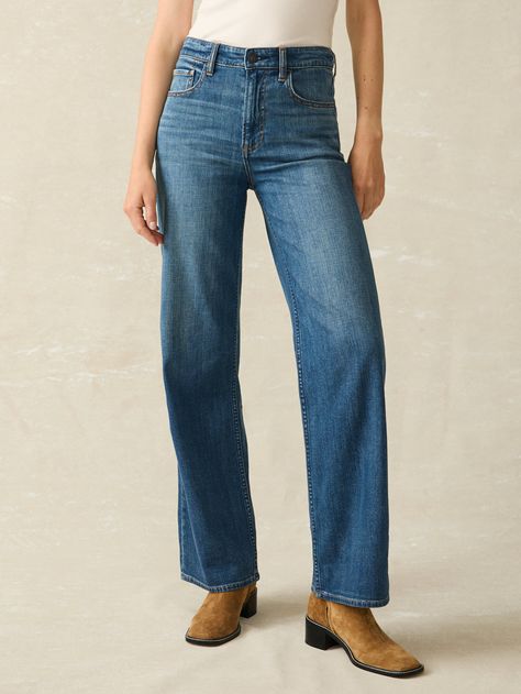 These new feather-light jeans are an ode to the most comfortable, broken-in denim you've ever had. Think super soft, stretchy, and breezy with a laidback drape that moves with you. Constructed with a high waist and wide leg, its easygoing essence was made for beachside strolls and weekend getaways in mind. Fit: Fitted waist and hip, wide legs. Inseam: 32" Detail: Denim 5 pocket jean. Super soft, drapey, light weight stretch denim fabric. Medium indigo wash. Material: 92% Organic Cotton, 6% Elasterell-P, 2% Elastane; Vintage inspired etched shank, metal zipper Model: Hartje is 5’9 wearing size 27" Care: Close all zippers before wash. Turn inside out. Machine Wash cold With like colors. Delicate cycle. Do not bleach. Tumble dry low. Remove promptly. Warm iron when needed. Jean Wide Leg, Toned Women, Dream Jeans, Stretch Denim Fabric, Light Jeans, New Pant, Dress Shirts For Women, Weekend Wear, Sweater Sale